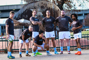 Team of rugby players posing for camera